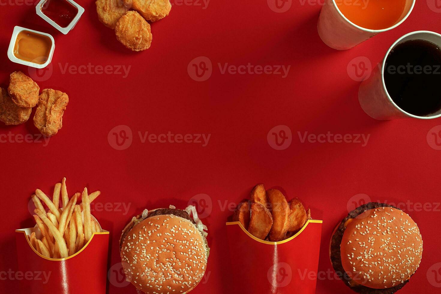 Burger and Chips. Hamburger and french fries in red paper box. Fast food on red background. photo