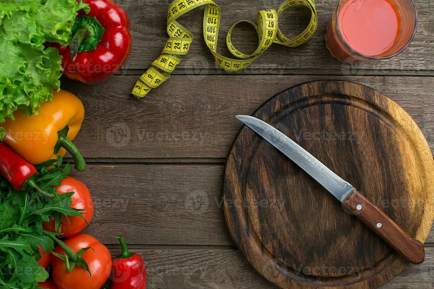 Sport and diet. Vegetables and centimeter. Peppers, tomatoes, salad on rustic background photo