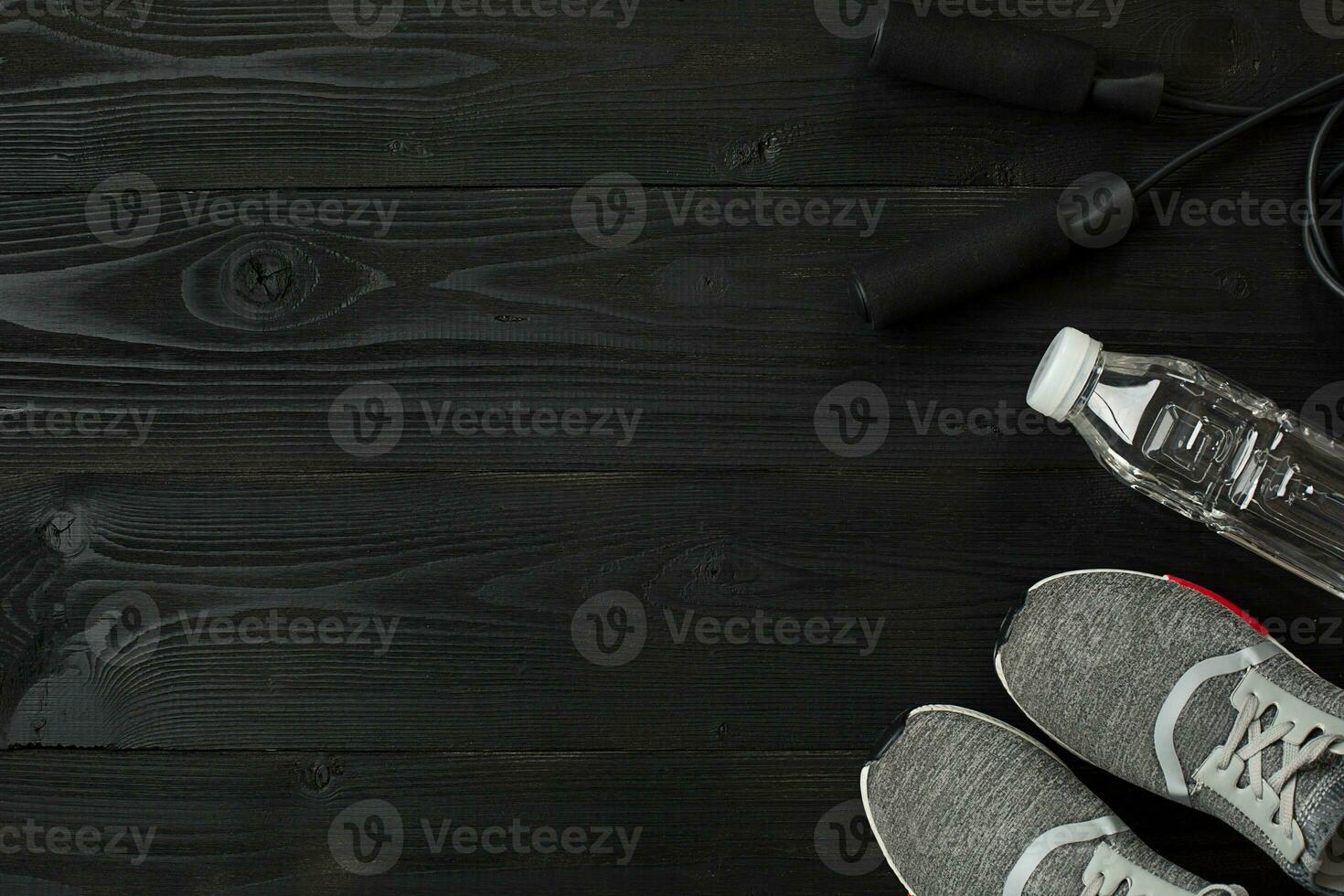 Sports accessories for fitness on the wooden floor. Healthy lifestyle concept. photo