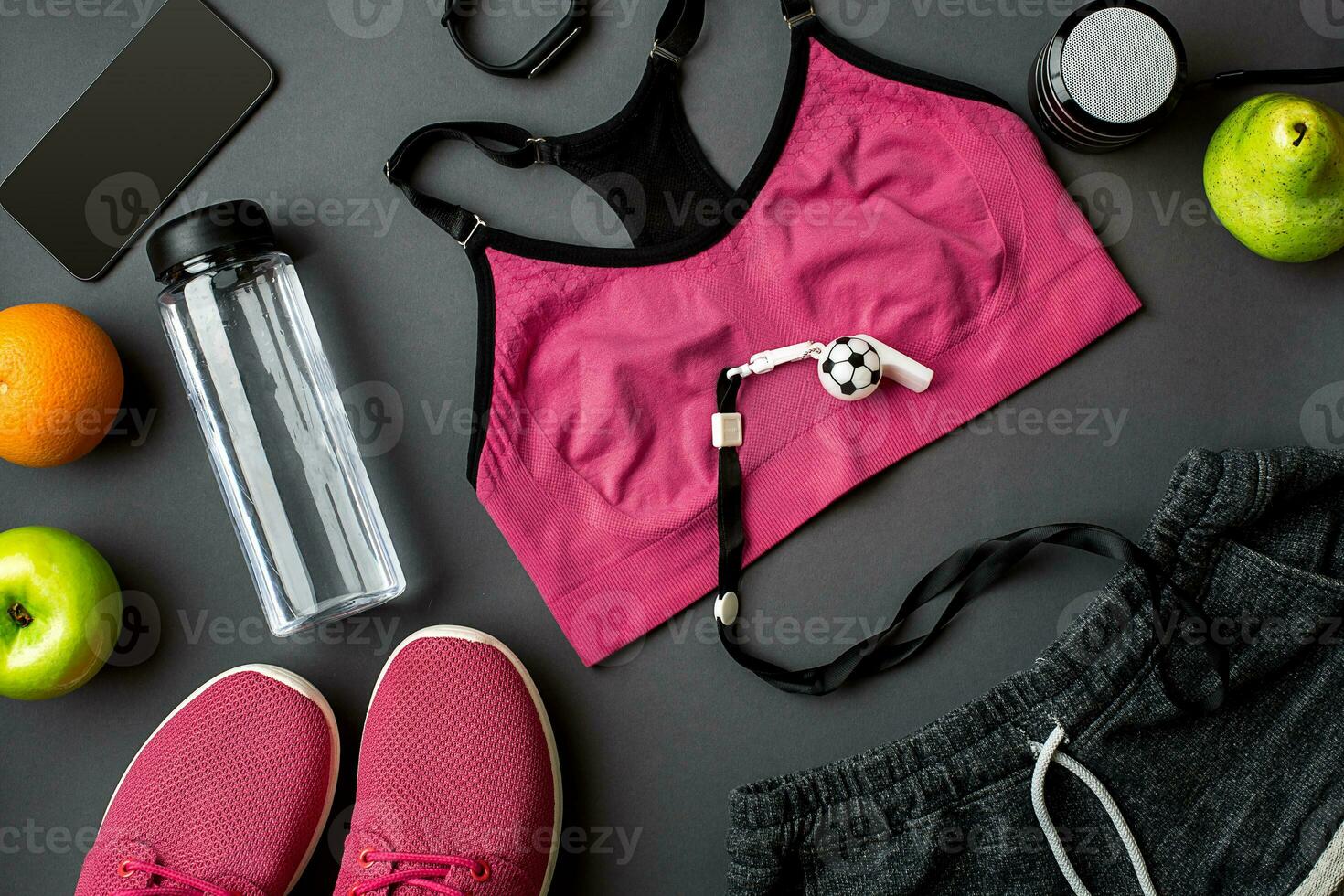 Sports accessories for fitness on the dark floor. Healthy lifestyle concept. photo