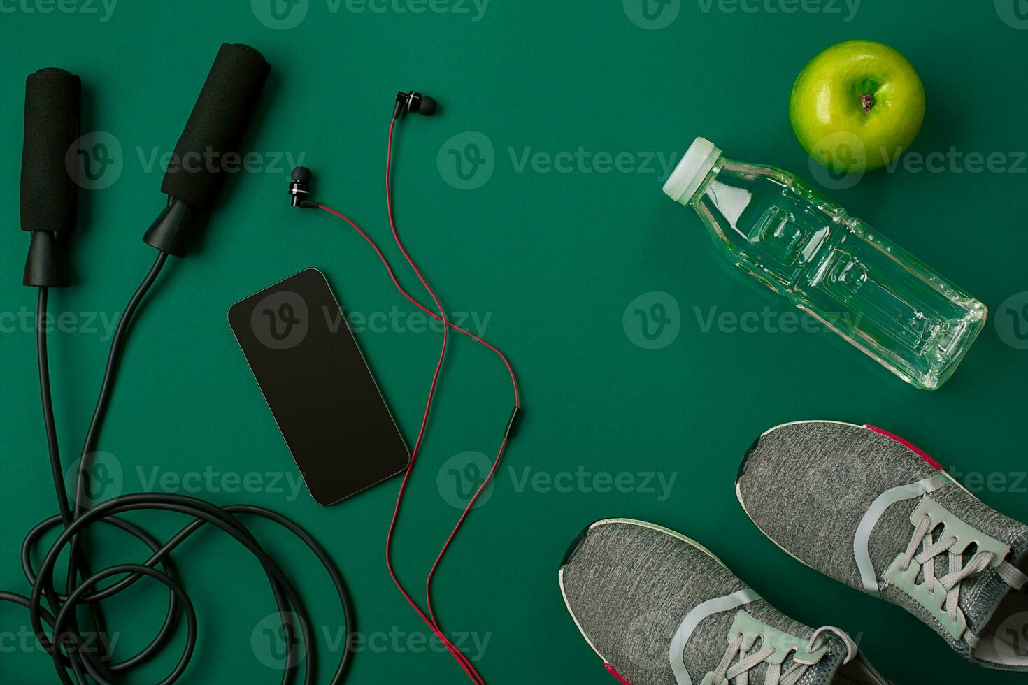 Sports accessories for fitness on the green floor. Healthy lifestyle concept. photo