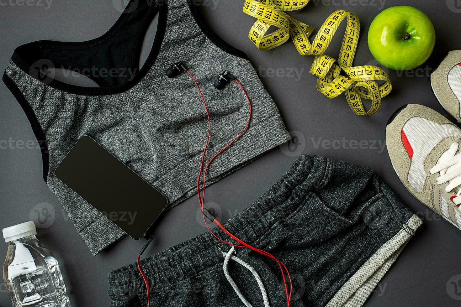 Sports accessories for fitness on the dark floor. Healthy lifestyle concept. photo