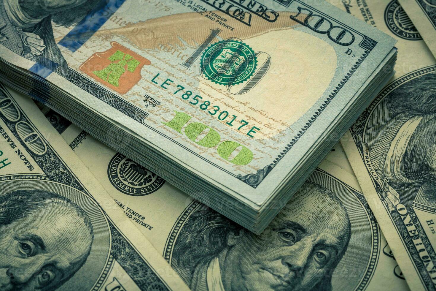 Lot of one hundred dollar bills close-up background photo