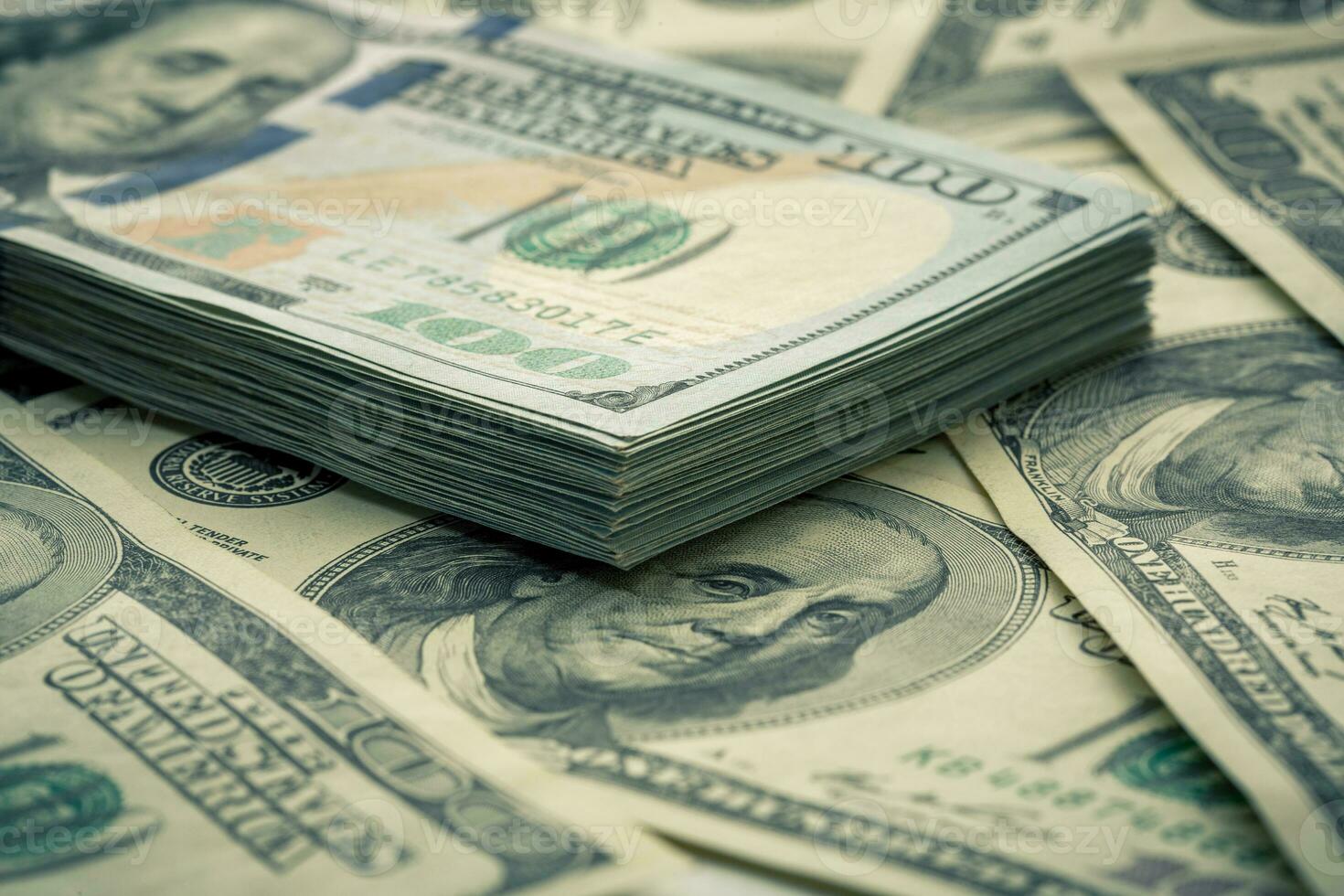 Lot of one hundred dollar bills close-up background photo