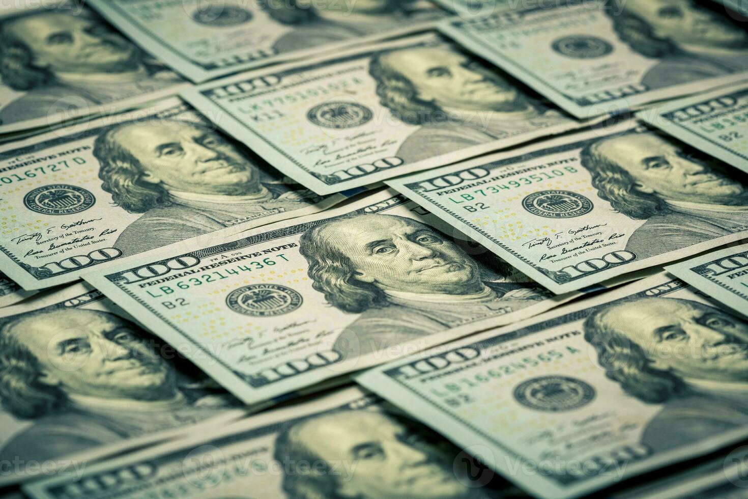 Lot of one hundred dollar bills close-up background photo