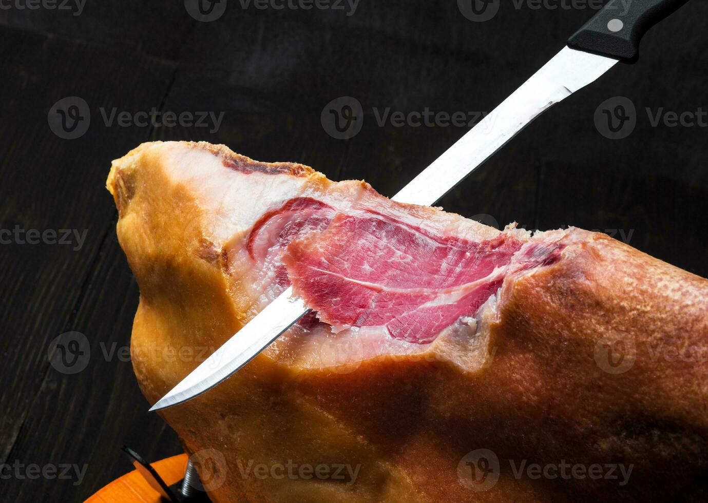 Jamon. Jamon serrano. Traditional Spanish ham on black close up. photo