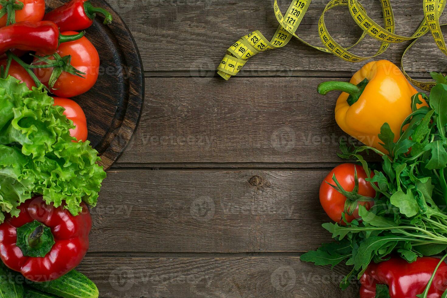 Fitness concept with vegetables. Fitness motivation with centimeter. Fitness motive. Pepper. photo
