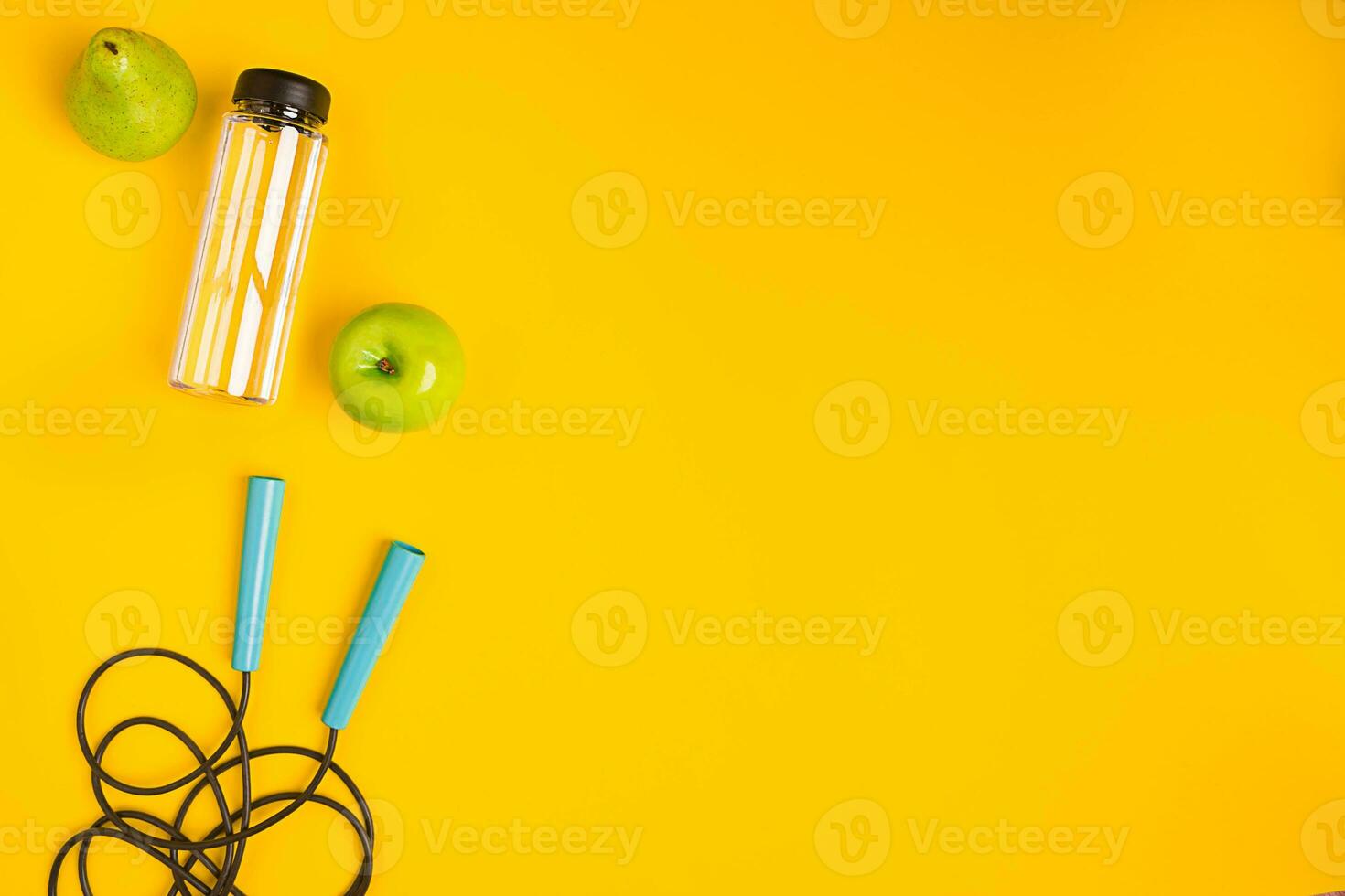 Top view of Skipping rope on yellow background photo
