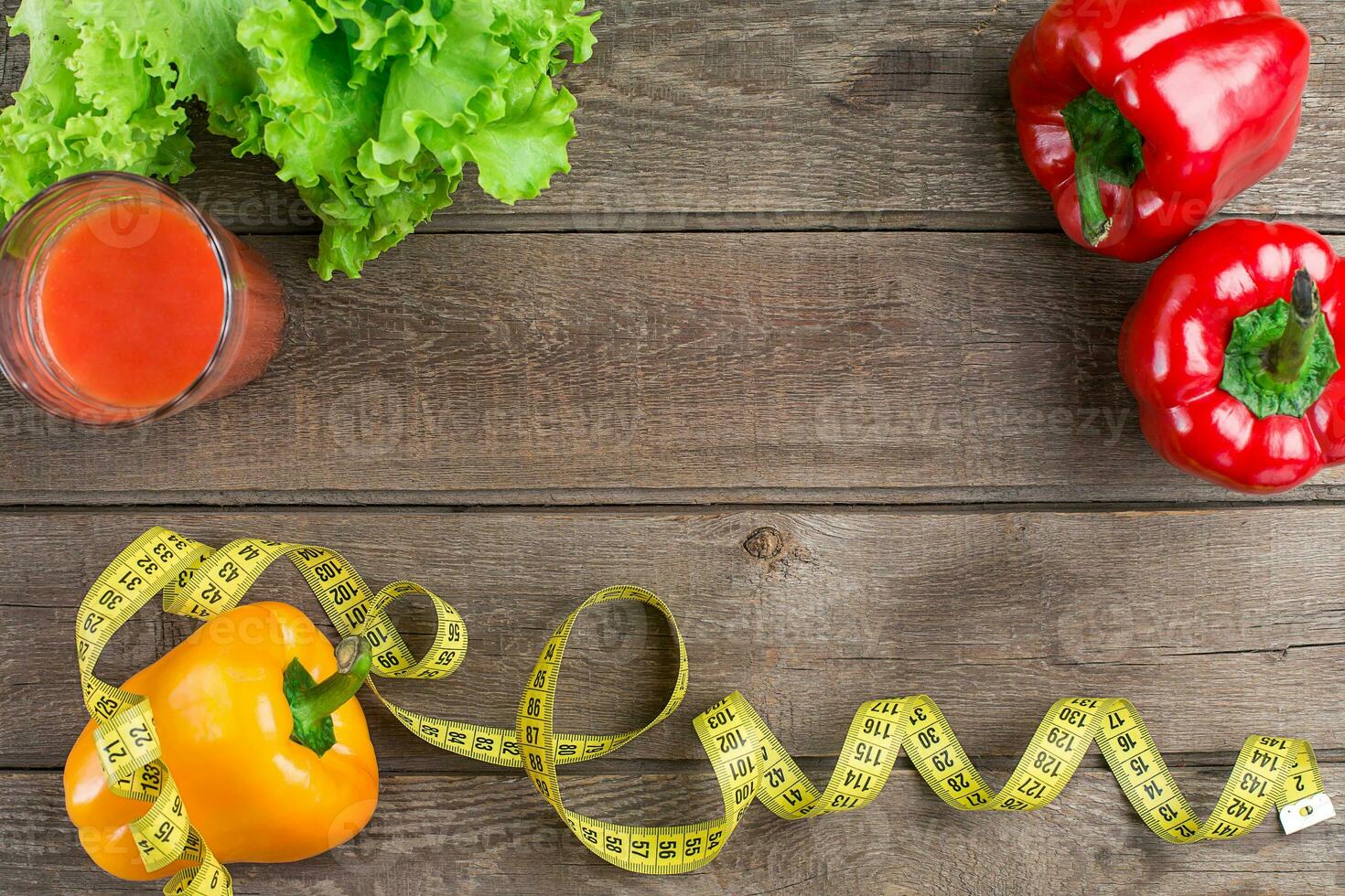 Fitness concept with vegetables. Fitness motivation with centimeter. Fitness motive. Pepper. photo