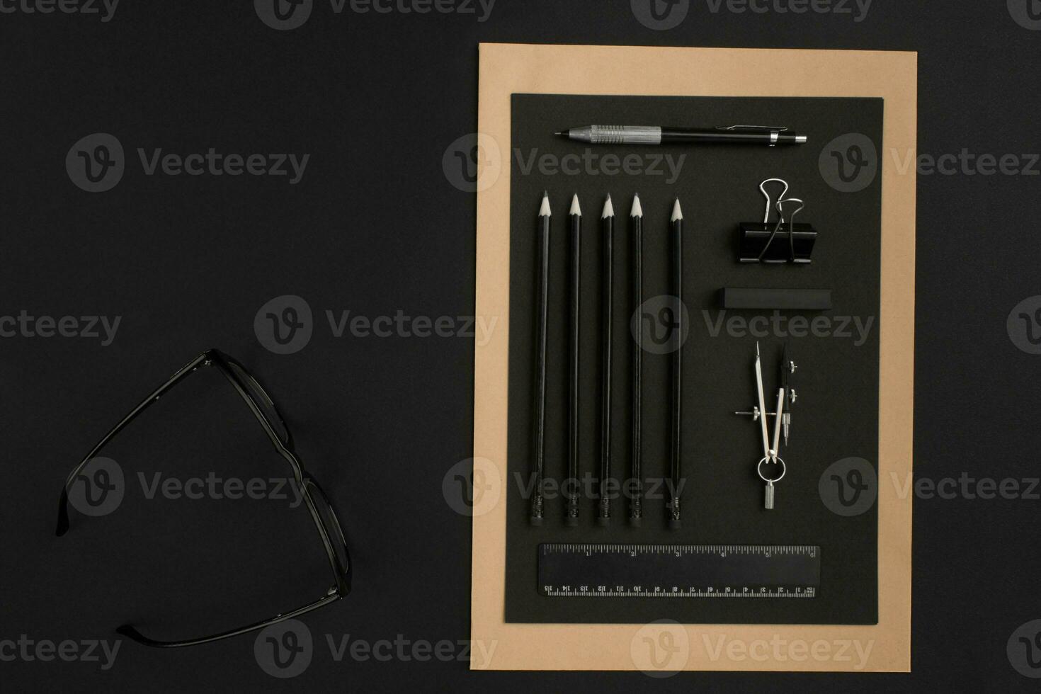 Mix of office supplies on a modern desk photo