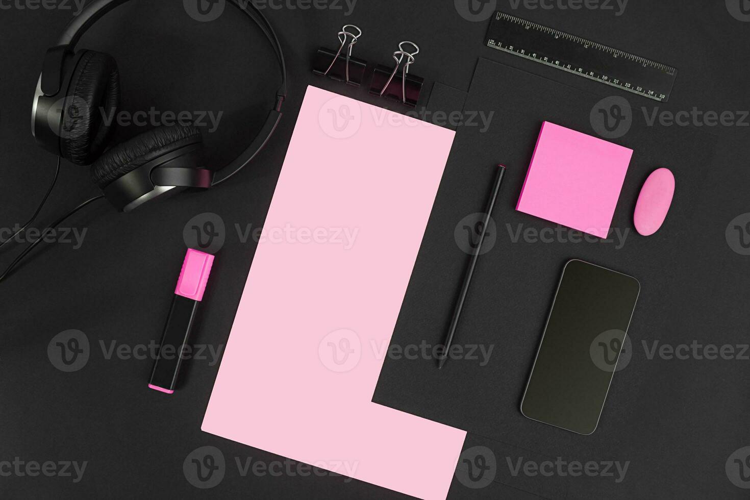 Top view of office supplies on blackboard background with copy space. photo