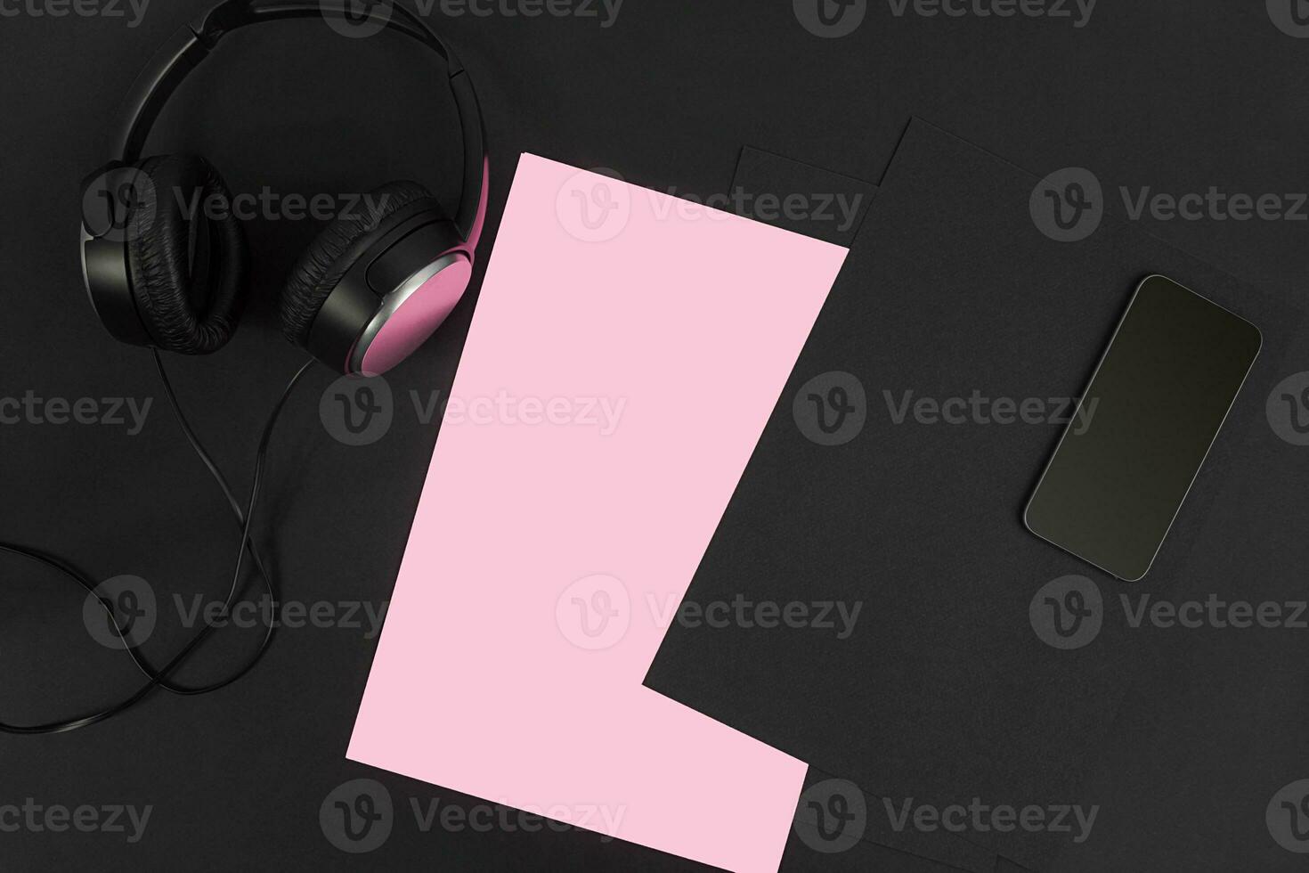 Top view of office supplies on blackboard background with copy space. photo