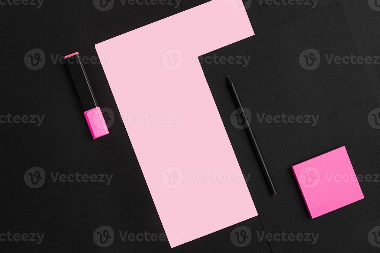 Top view of office supplies on blackboard background with copy space. photo