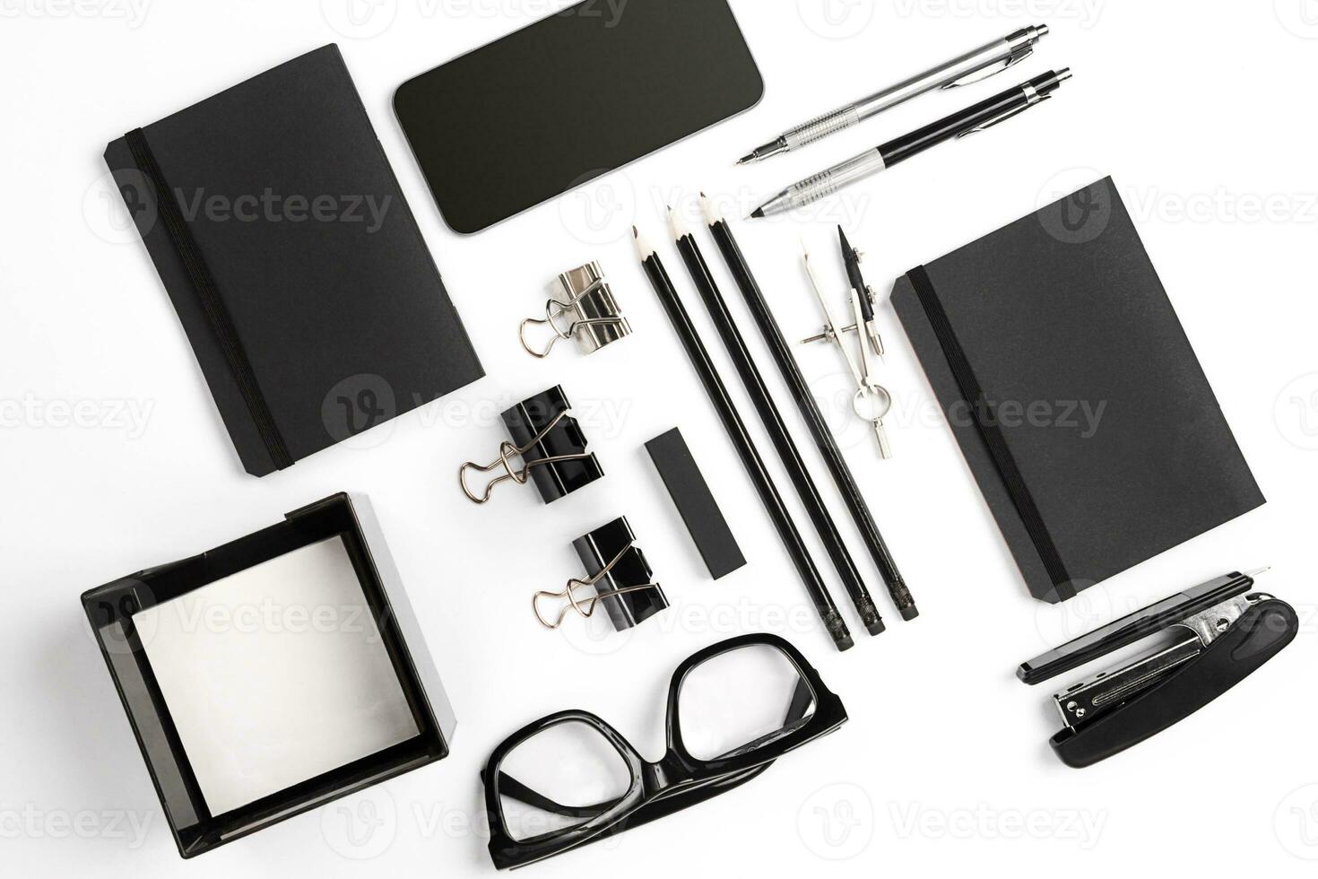 Mix of office supplies and business gadgets on a modern desk photo