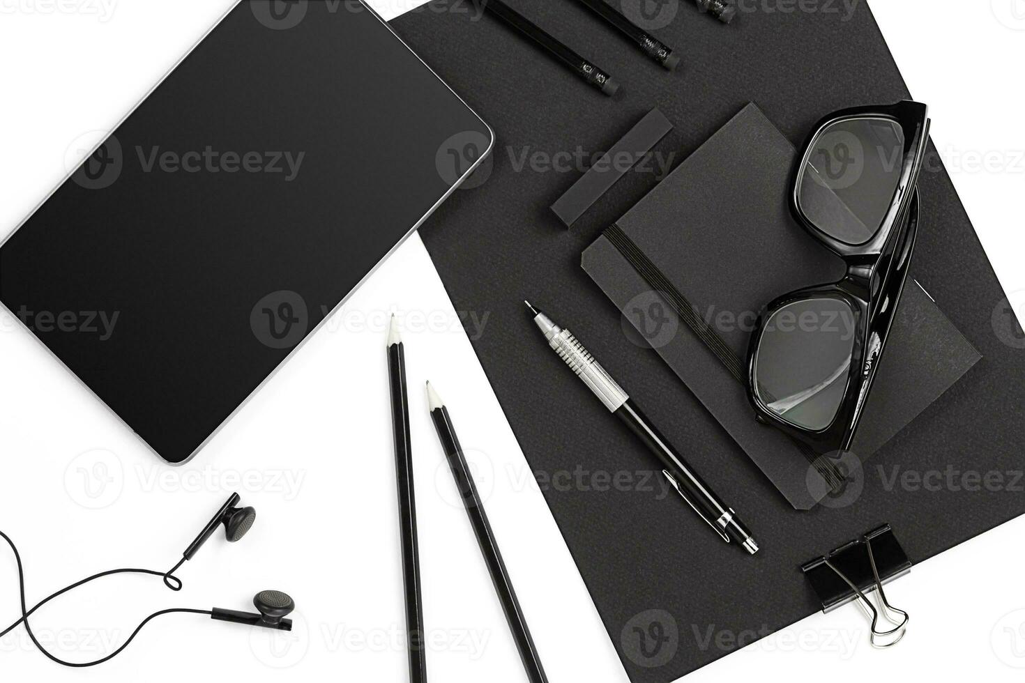 Mix of office supplies and business gadgets on a modern desk photo