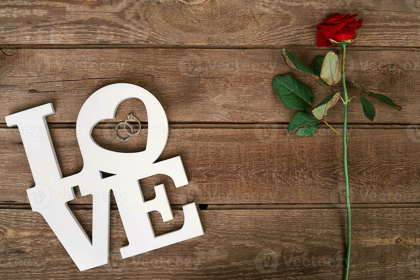 Red roses bouquet over wooden table. Top view with copy space. flowers photo