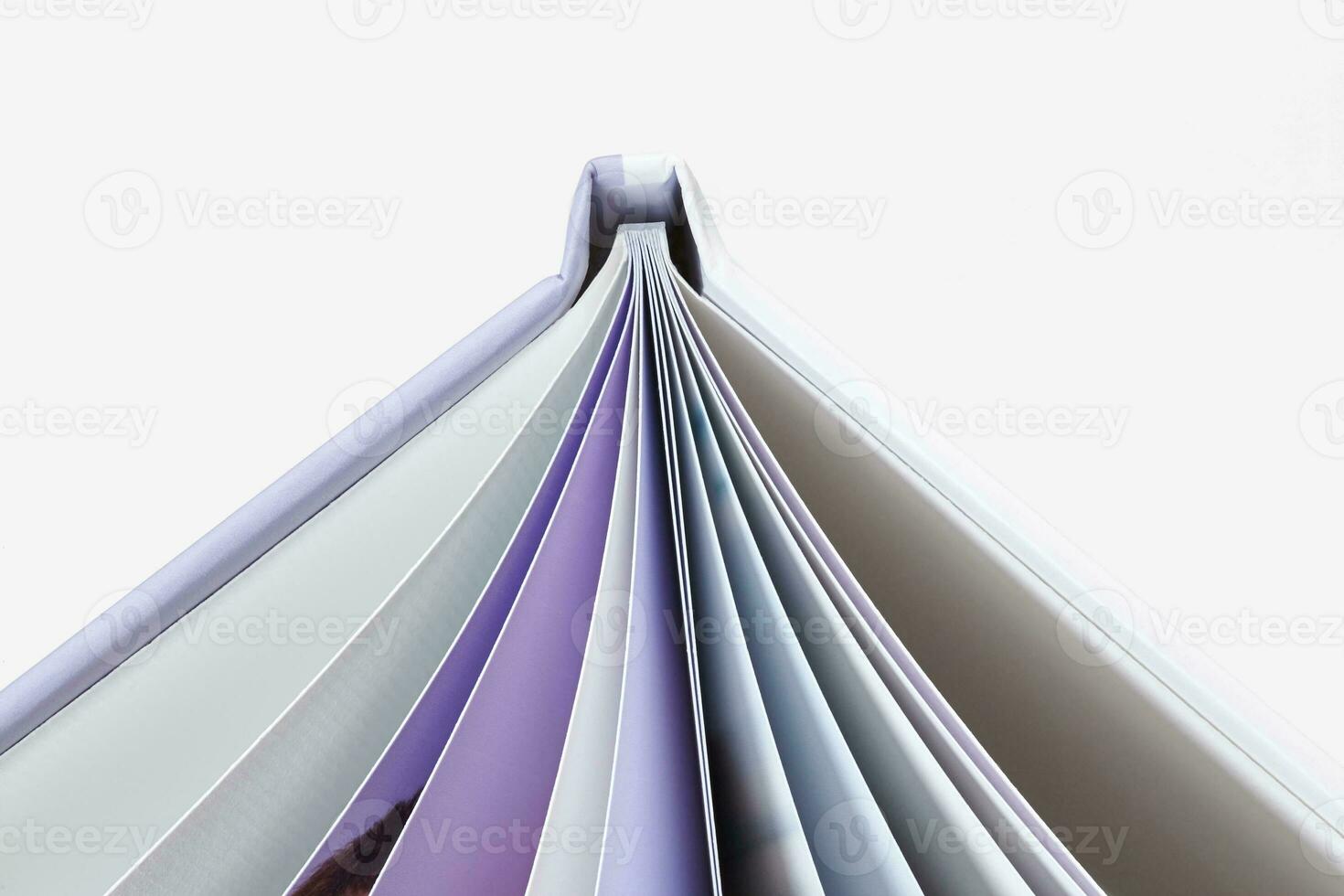 Open, high quality photo book with hardback and pages with colorful images isolated on white studio background. Close up, copy space