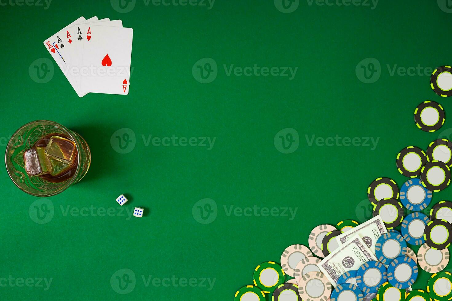 Set to playing poker with cards and chips on green table, top view photo