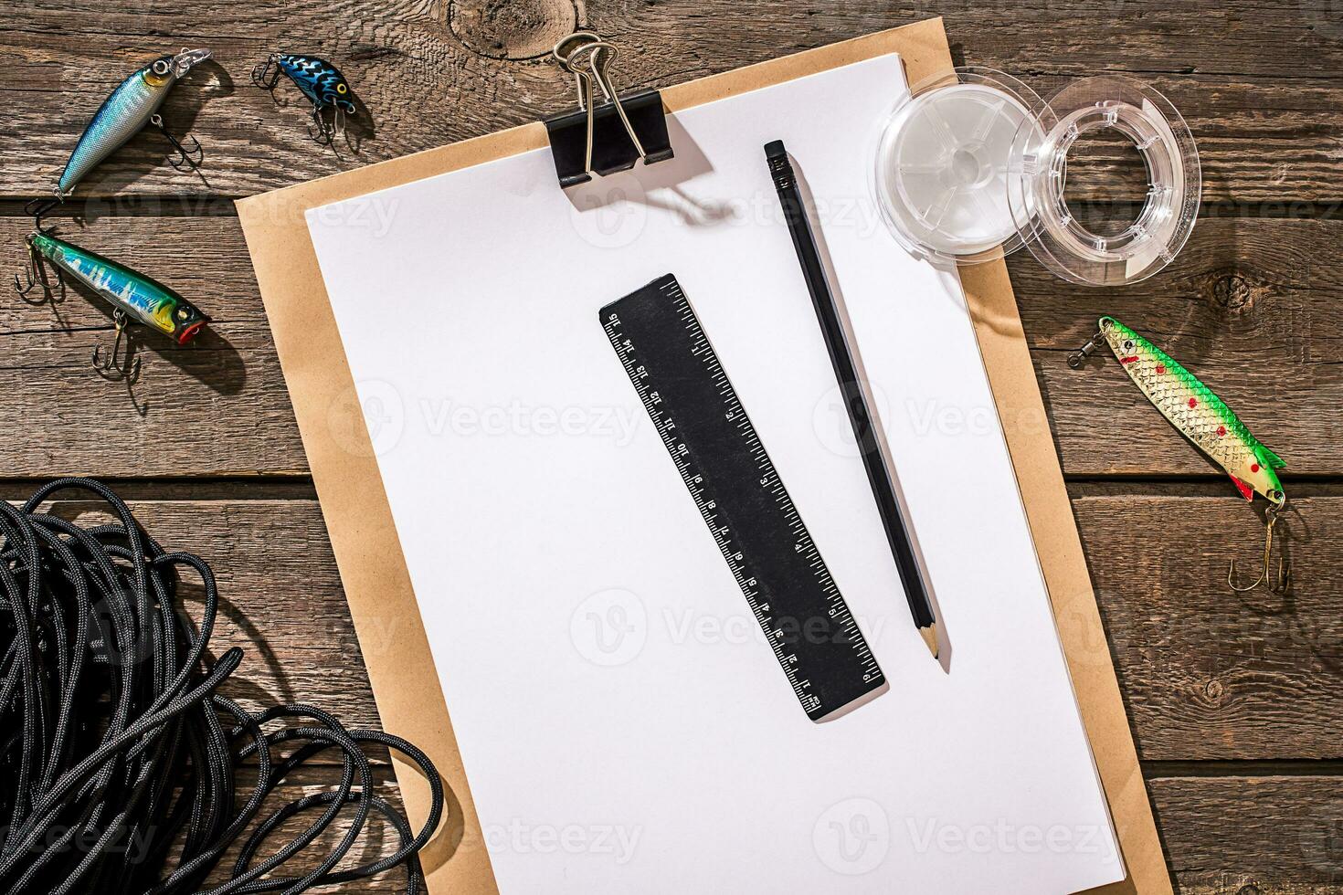 Accessories for fishing on the background of wood. Top view photo