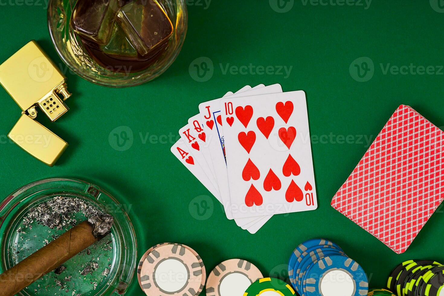 Set to playing poker with cards and chips on green table, top view photo
