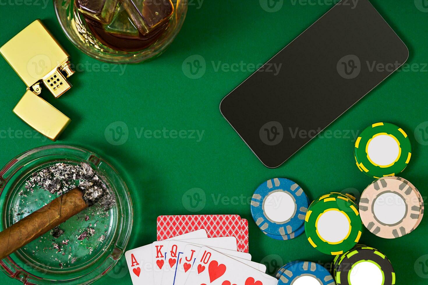 Set to playing poker with cards and chips on green table, top view photo