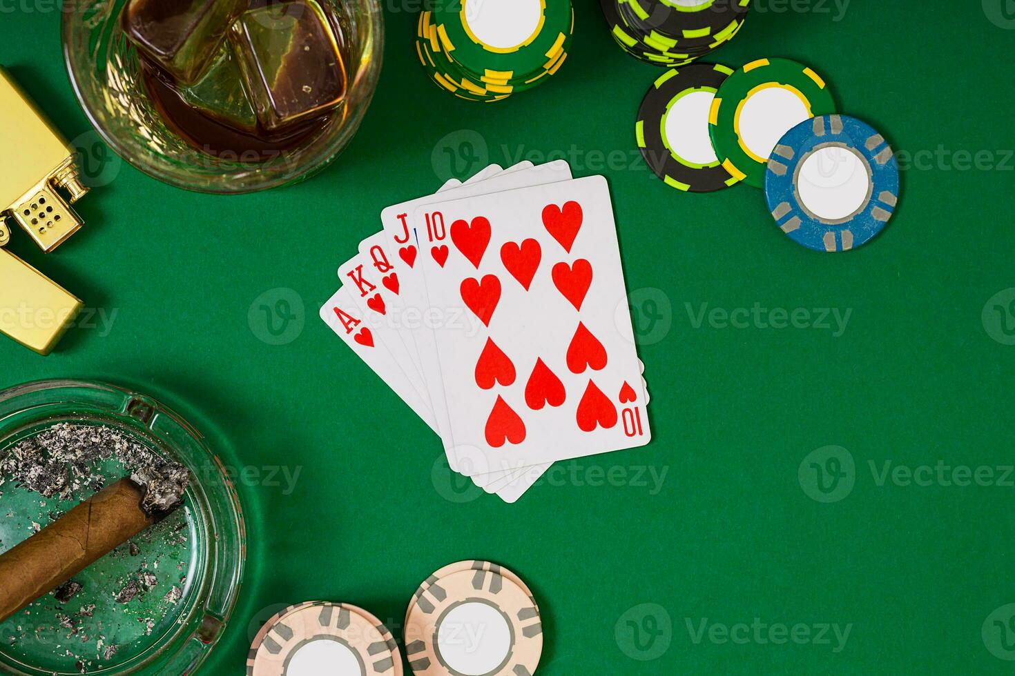 Set to playing poker with cards and chips on green table, top view photo