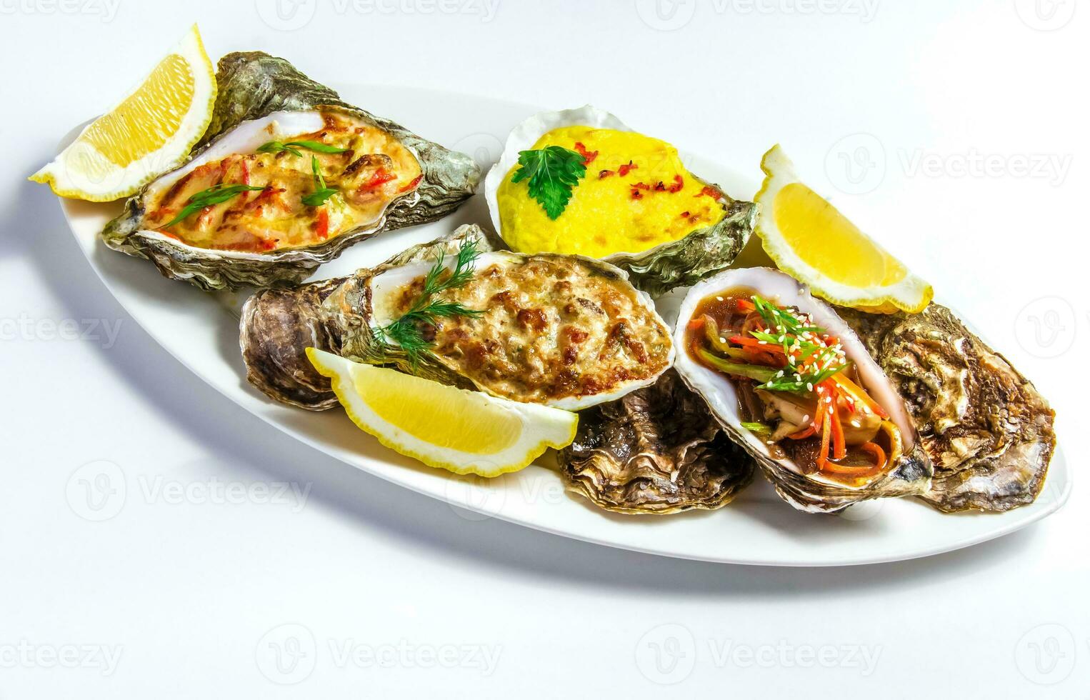 Dish with baked oyster shell cheese, salad oysters, served green photo