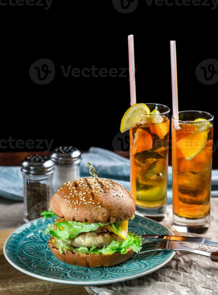 Sandwich with chicken burger, cheese and lettuce photo