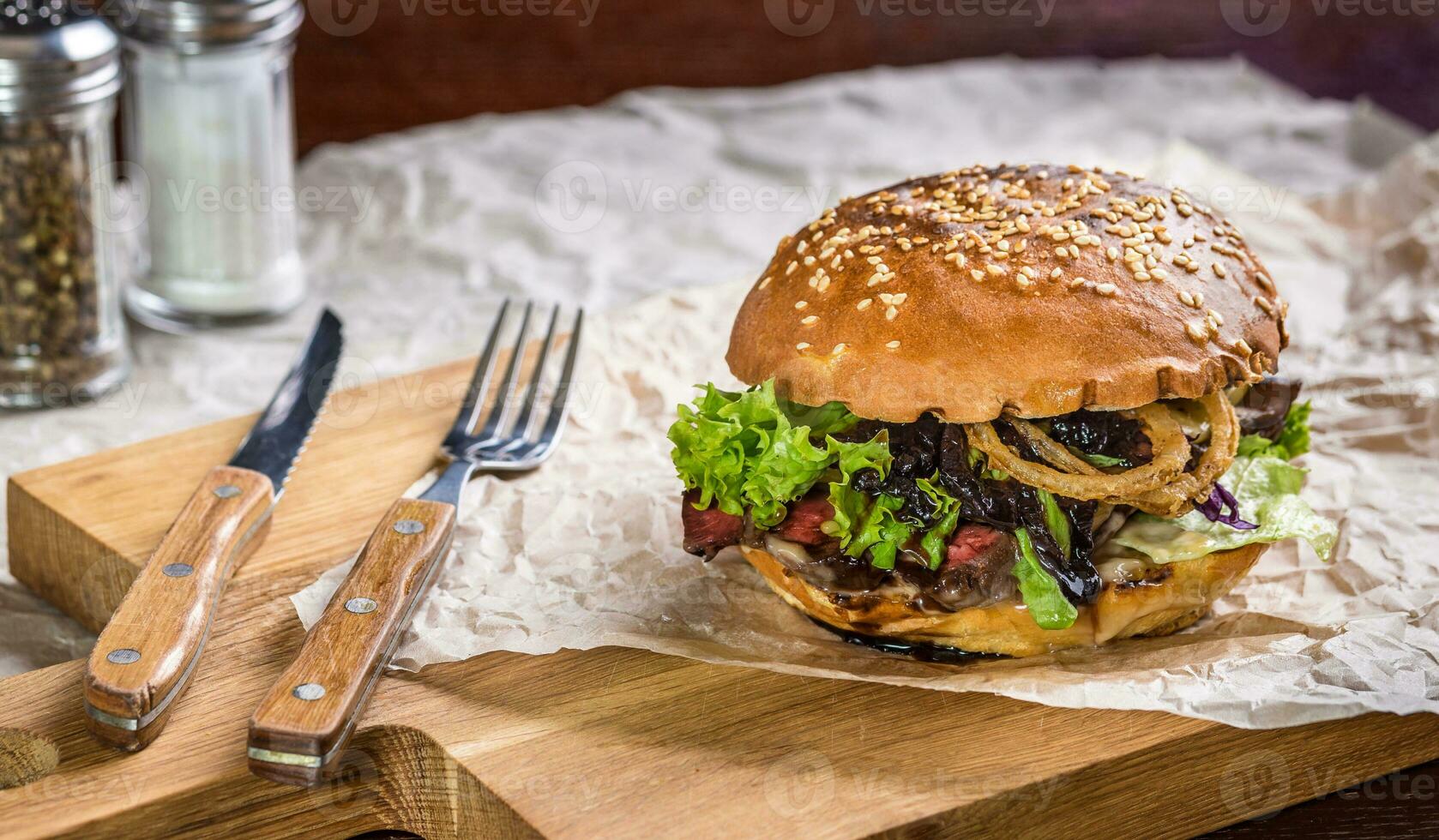 Homemade burger on the wooden table photo