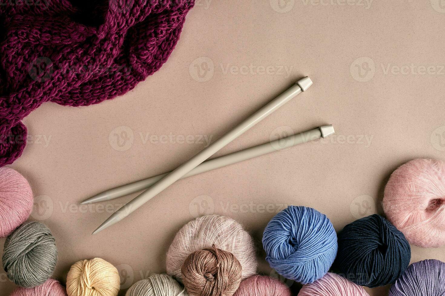 Set of colorful wool yarn on beige background. Top view photo