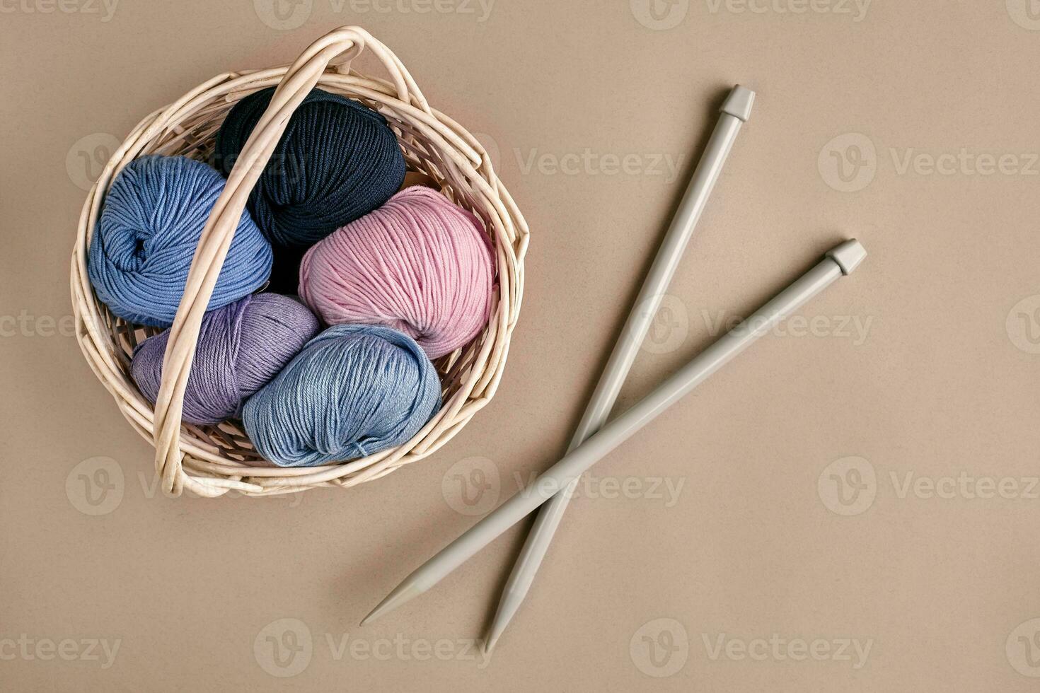 Balls of yarn with knitting needles on white background Stock Photo by  AtlasComposer