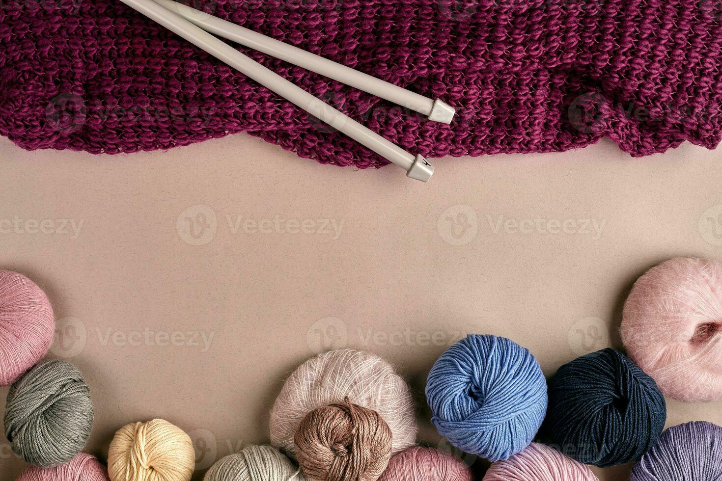 Set of colorful wool yarn on beige background. Top view photo