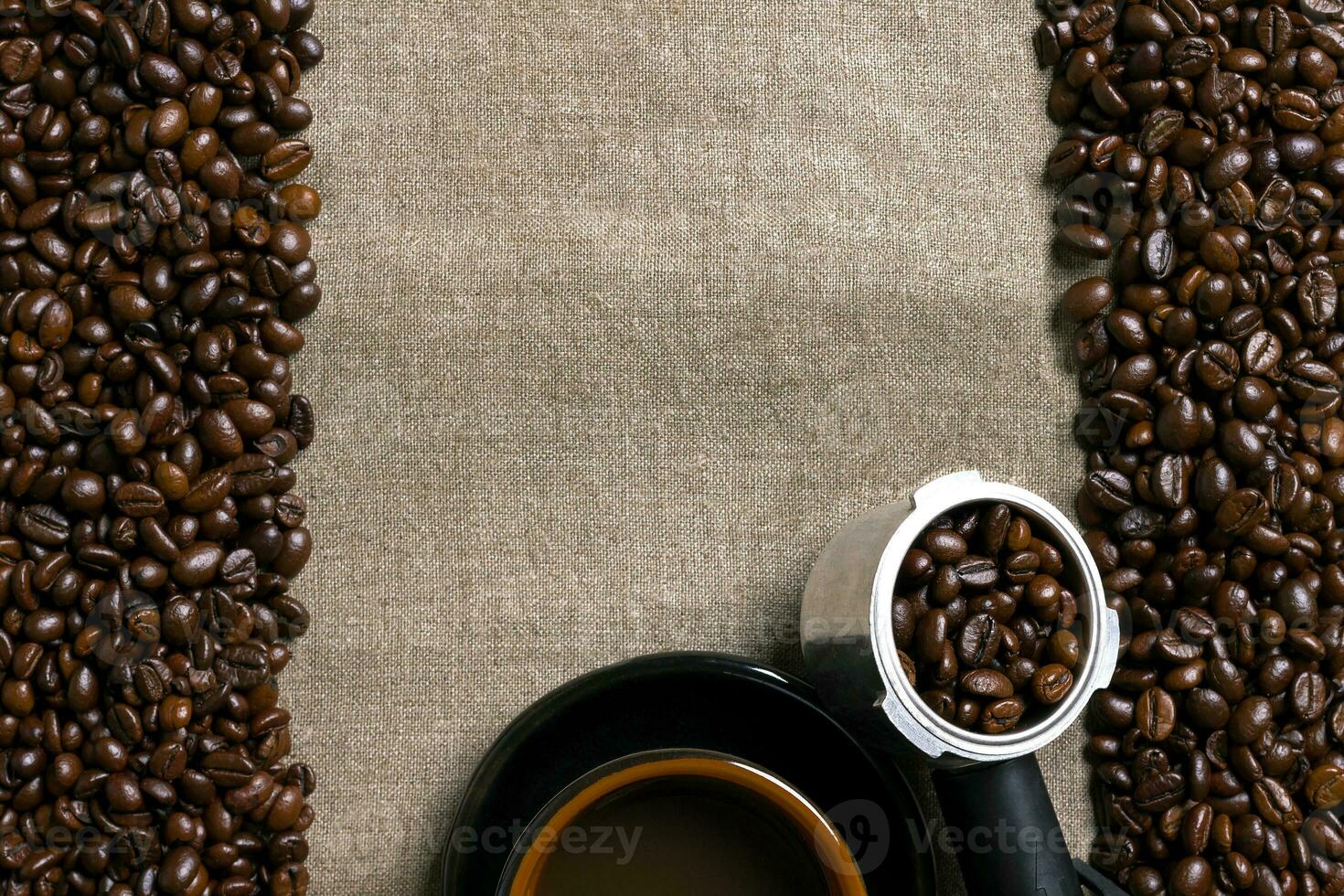 Coffee beans and Coffee cup on a burlap background photo