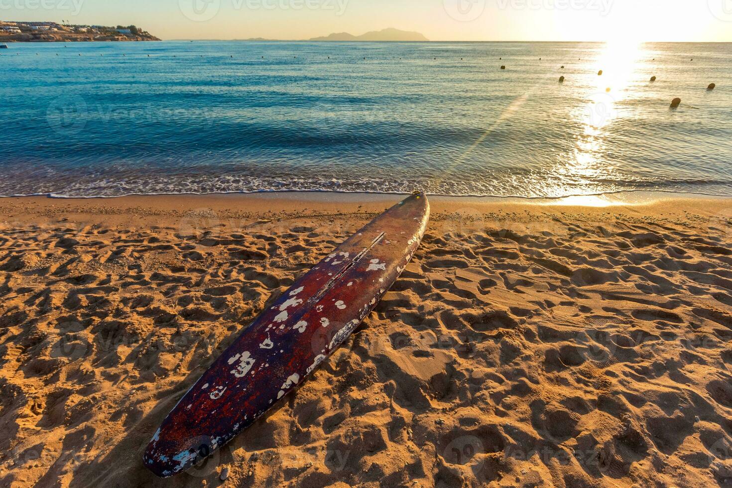 Beach coast with float in the Red Sea during sunrise. photo