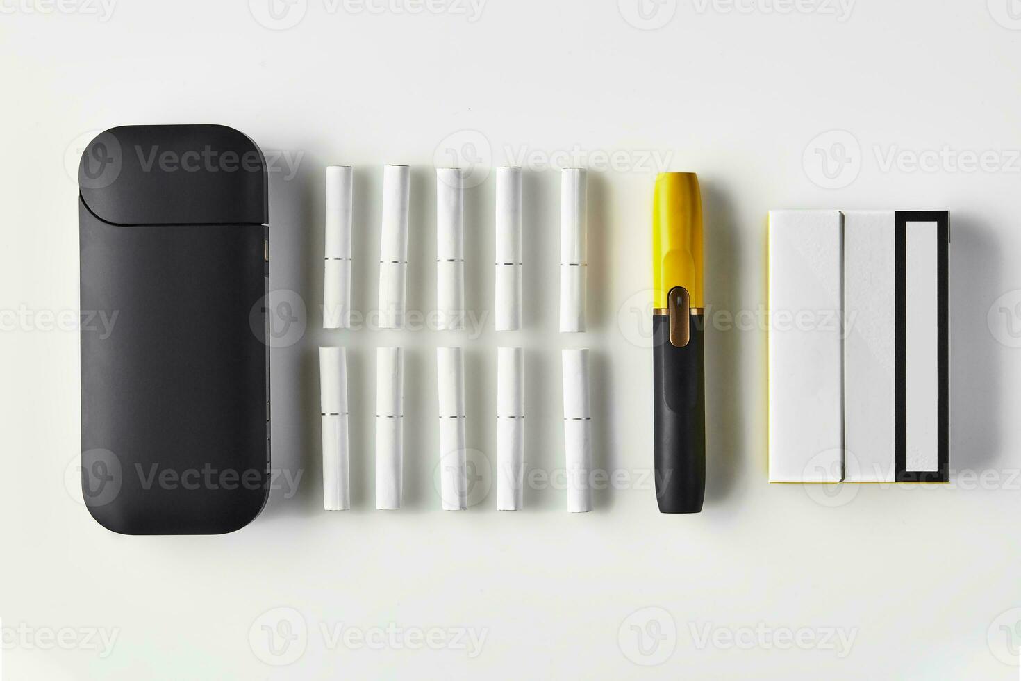 New generation black and yellow electronic cigarette and battery, one pack and ten heatsticks isolated on white. Heating tobacco system. Close up photo