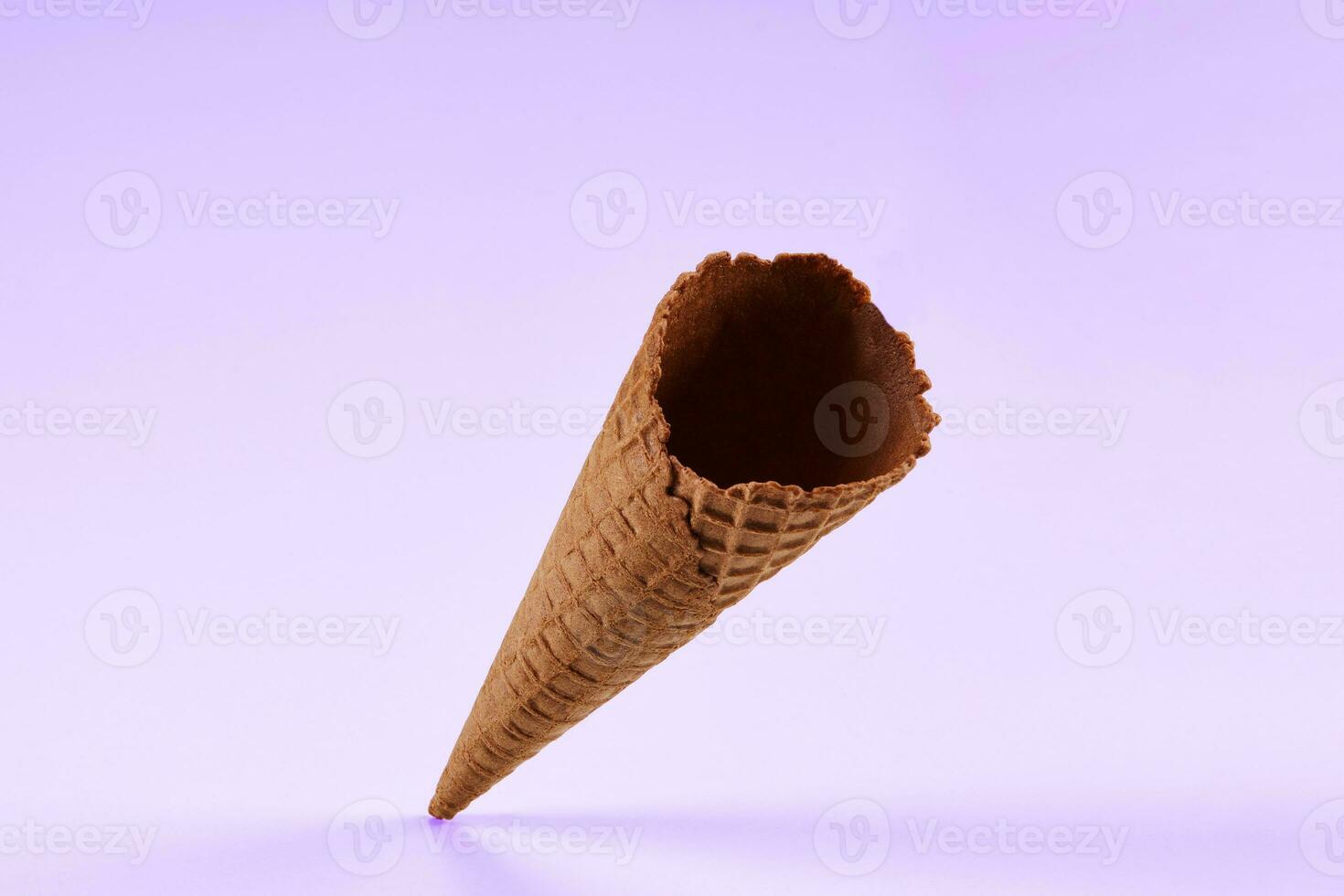 Empty, delicious, chocolate wafer cone for ice cream isolated on white. Concept of food, treats. Mockup, template for advertising and design. Close up photo