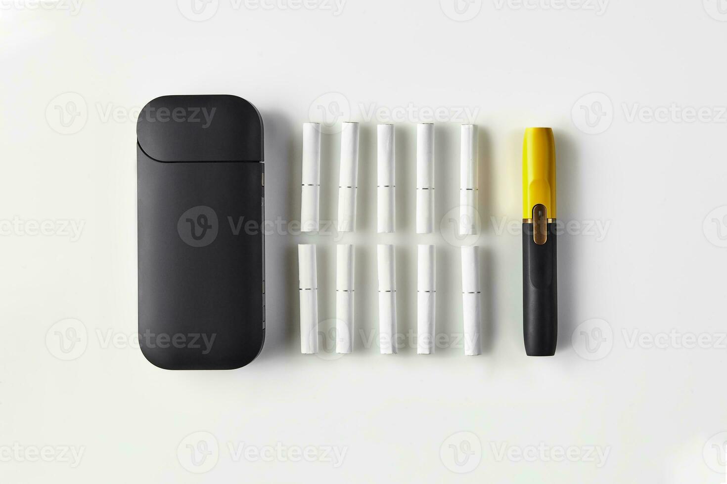 New generation black and yellow electronic cigarette, battery and ten heatsticks isolated on white. New technology. Heating tobacco system. Close up photo
