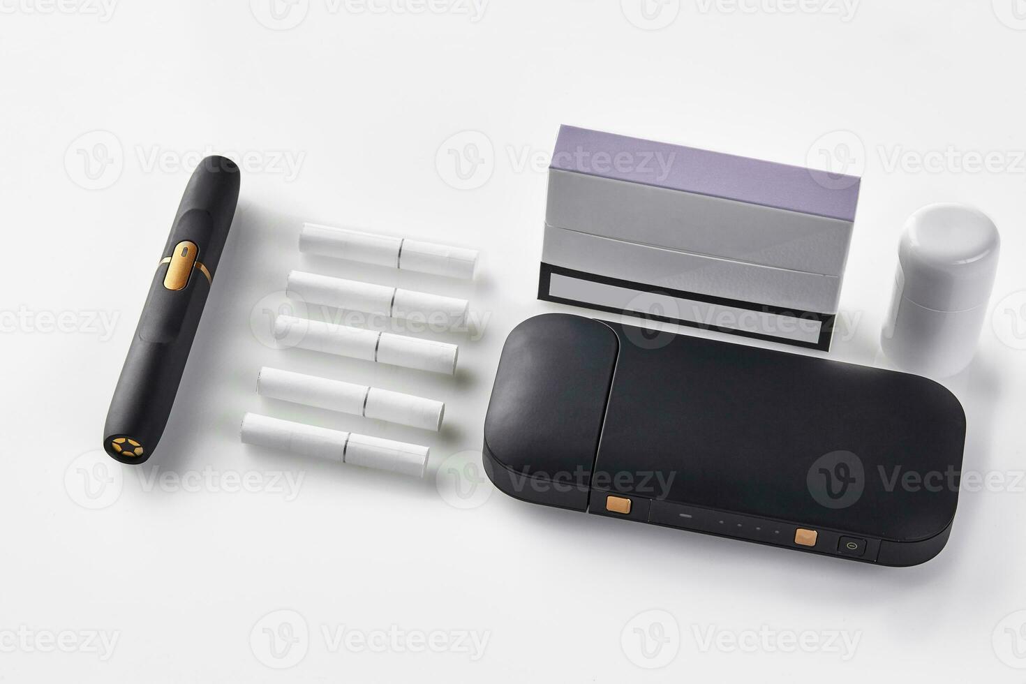 New generation black electronic cigarette battery, cleaner, pack with purple side, five heatsticks isolated on white. Heating tobacco system. Close up photo