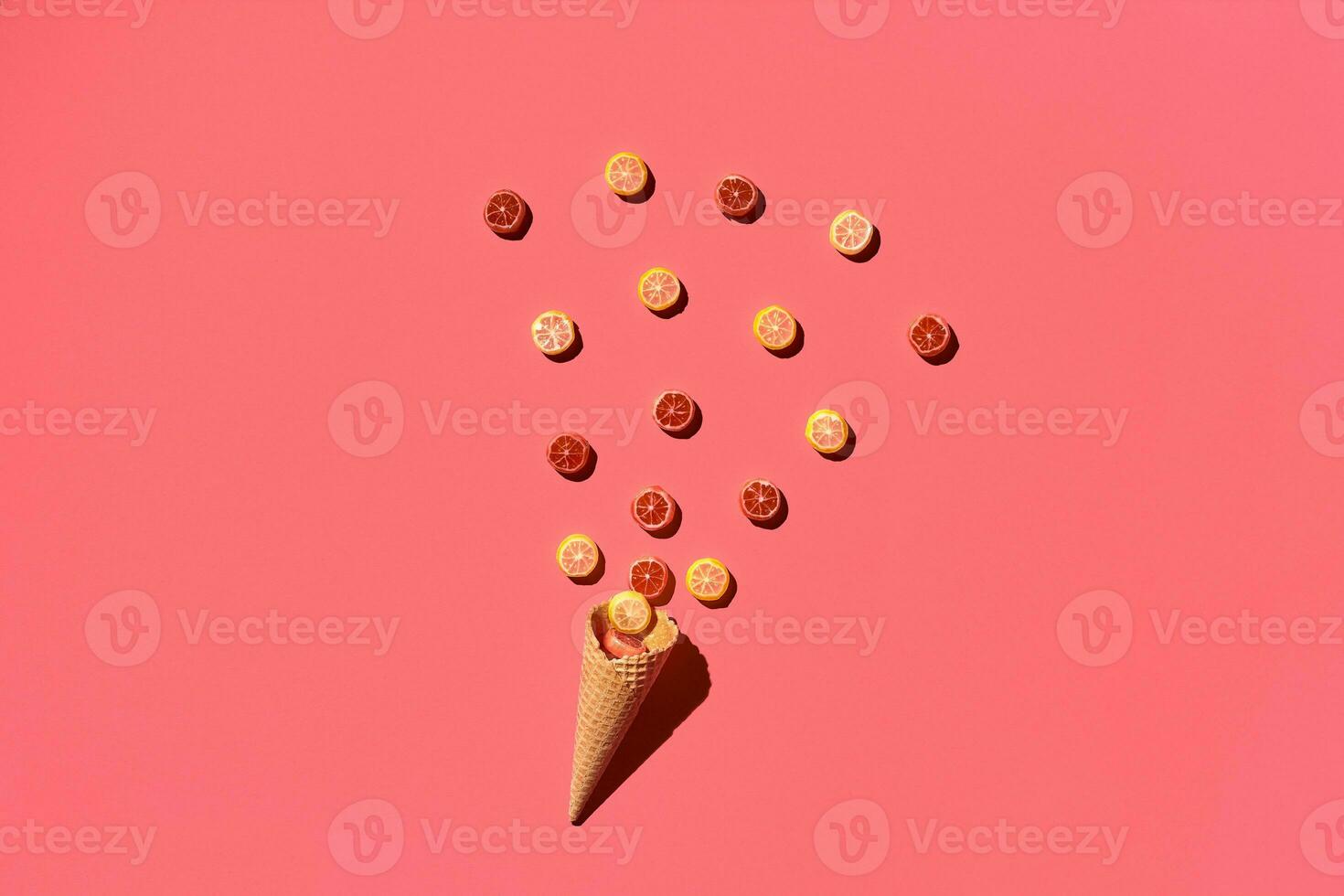 A variety of delicious sweets explode from the waffle cone, view from above. From left to the right direction photo