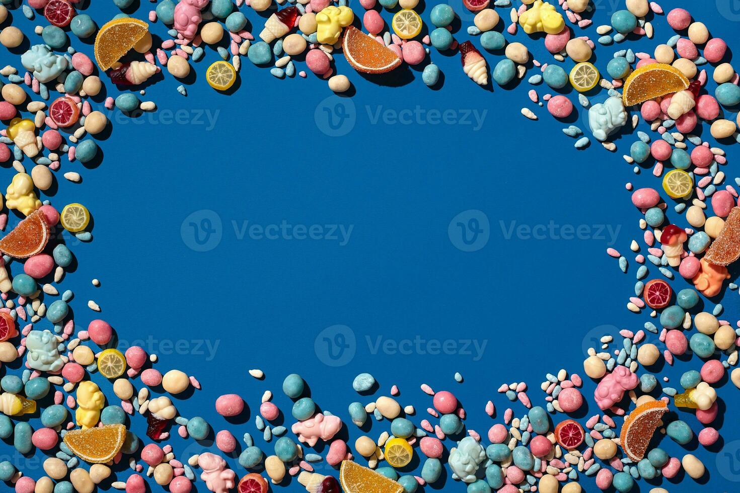 Photo of candies dragee placed on the perimeter of image with a copy space in the middle