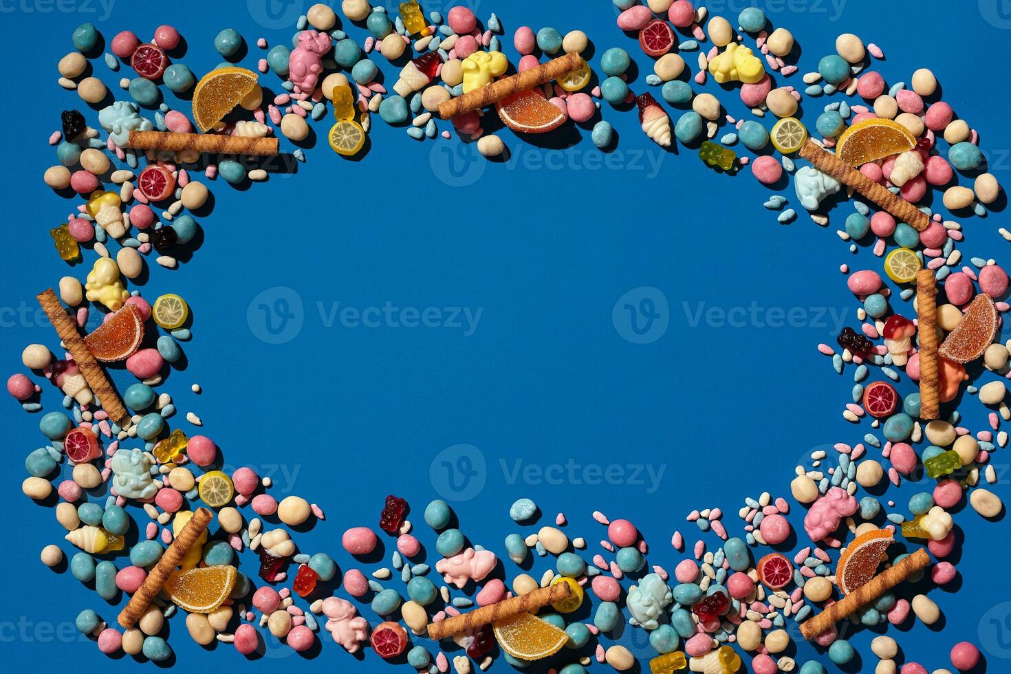 Photo of candies dragee placed on the perimeter of image with a copy space in the middle