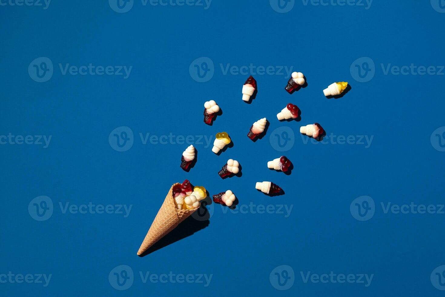 An image of a heap of jelly bean that is sprinkled from a waffle cone photo