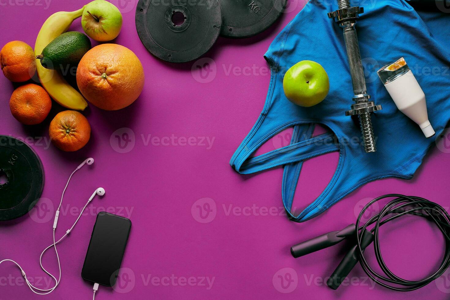 Fitness female outfit background top view. Set of sport clothing and equipment for women, active lifestyle photo