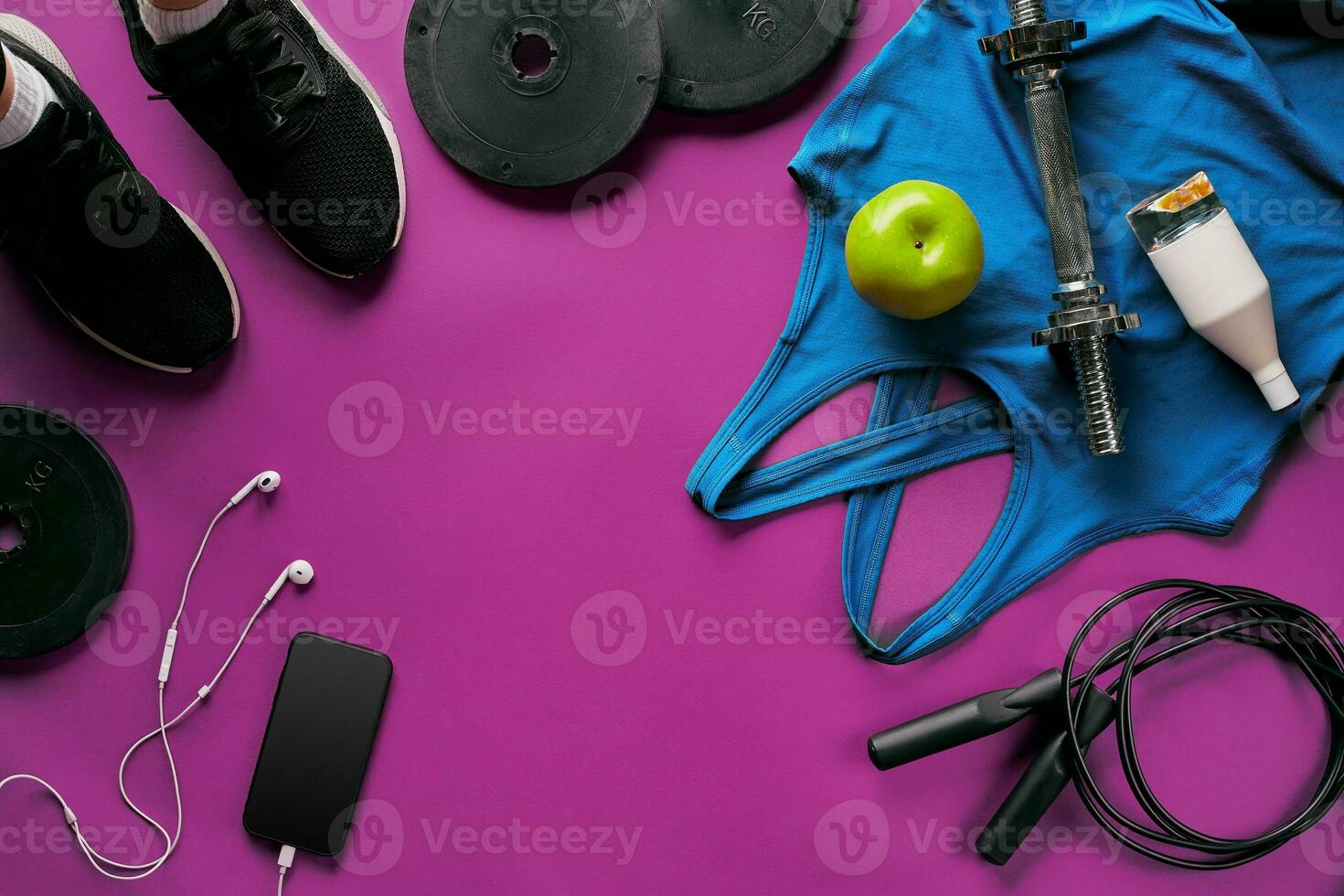 Fitness female outfit background top view. Set of sport clothing and equipment for women, active lifestyle photo