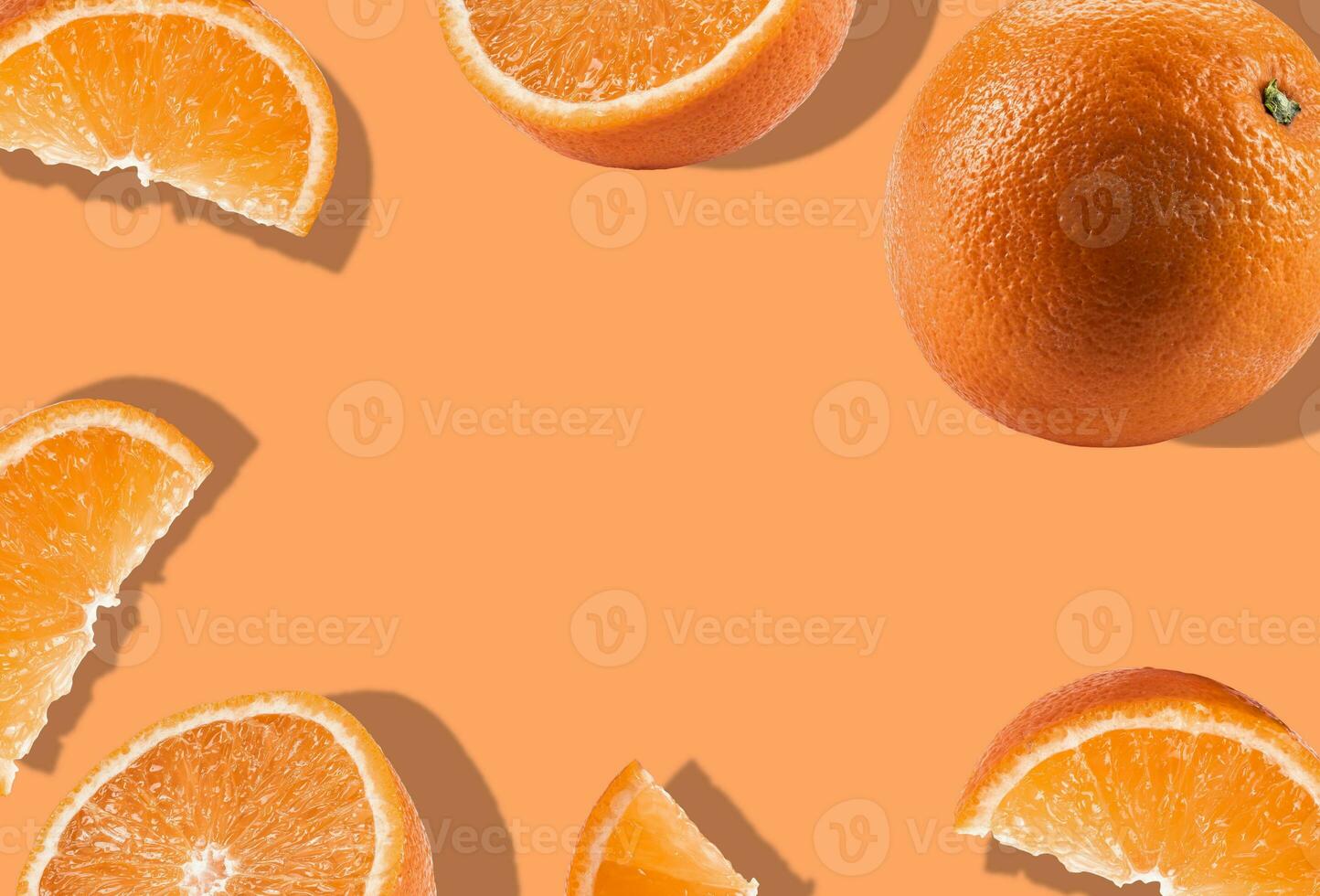 Orange with halves and slices on orange background with copy space for text or images. Fruit with mellow flesh. Close-up, shadow. Collage, top view. photo