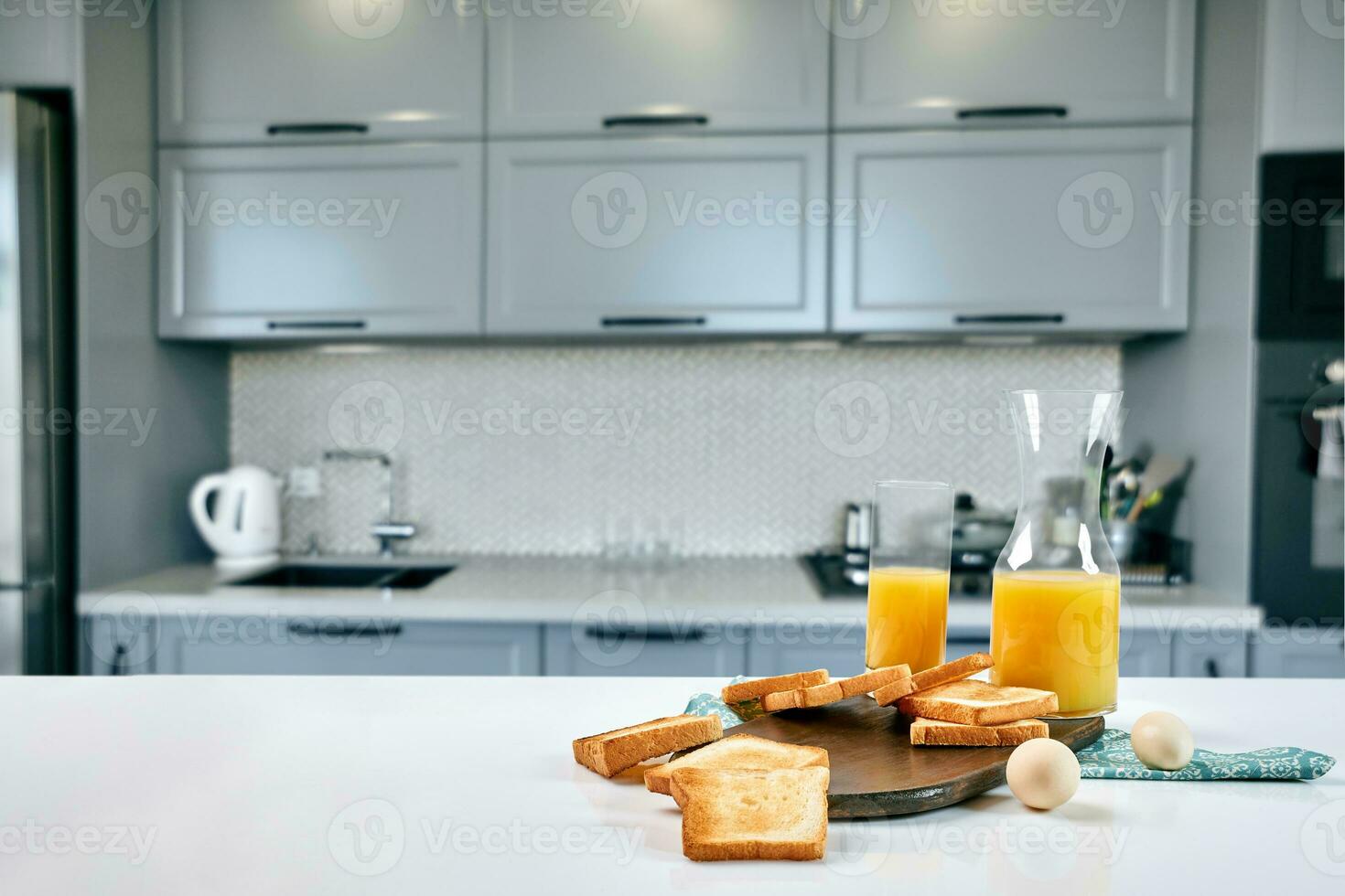 Continental breakfast - orange juice and toast on white table. photo