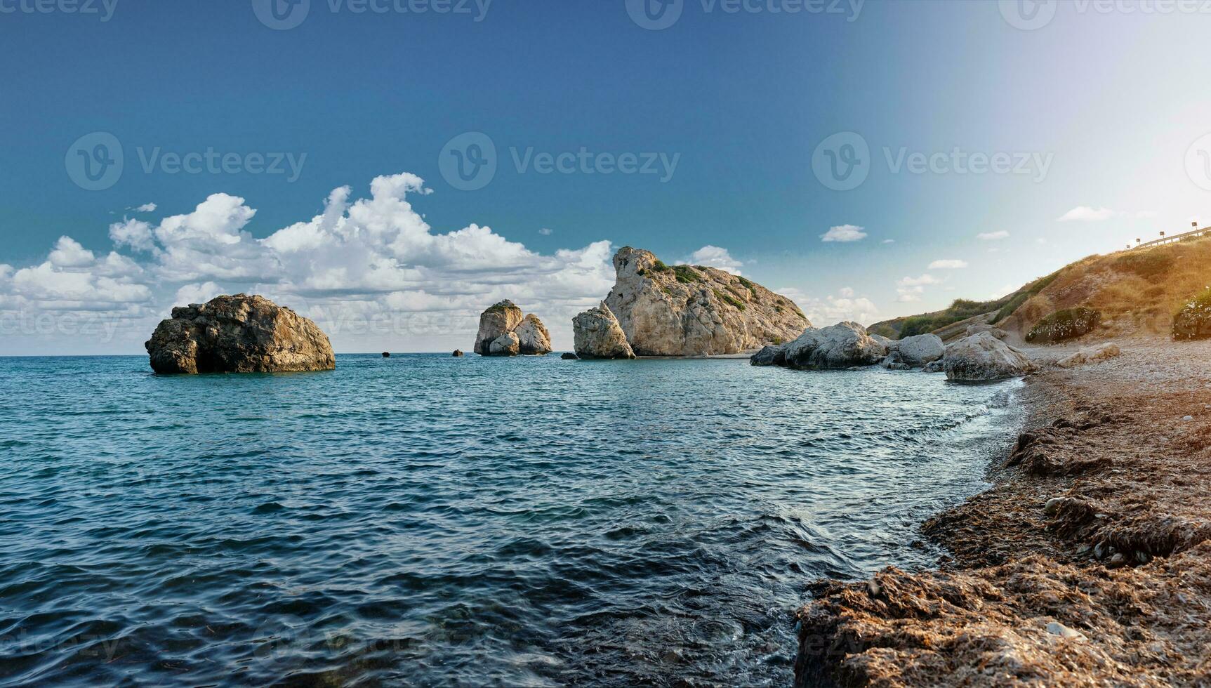 Panoramic shot of the coast of Aphrodite's birthplace near Paphos city, Cyprus. A popular holiday destination. Tourism, vacation, traveling concept. photo