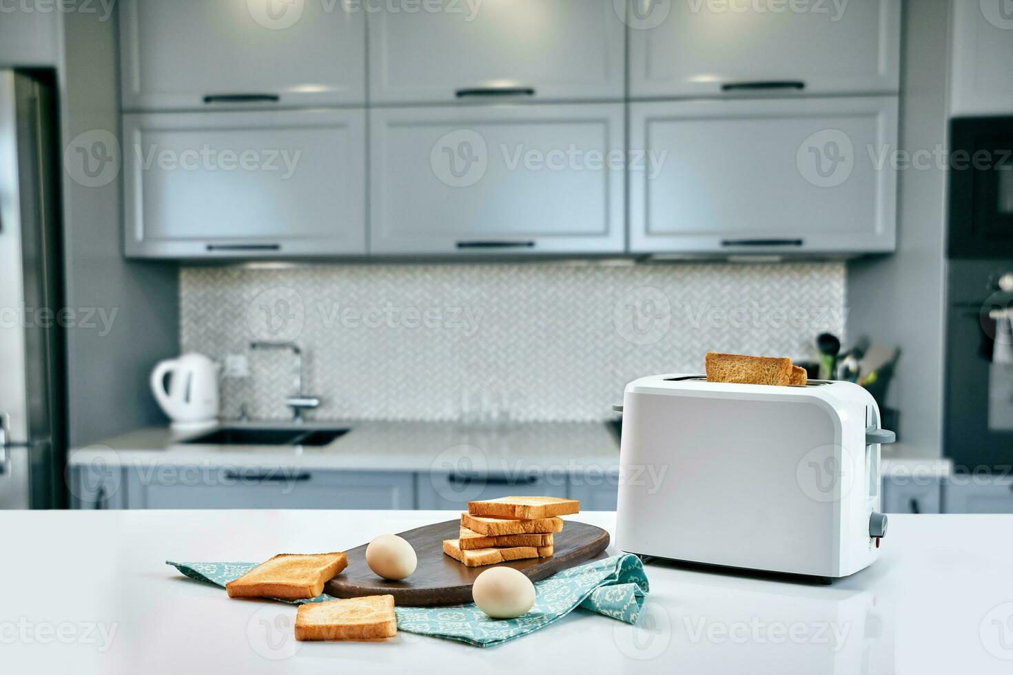 Hot morning in a white kitchen with fresh toast photo