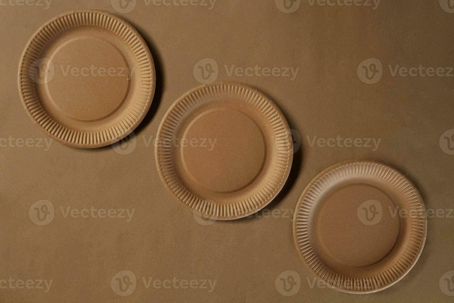 Eco friendly disposable tableware. Biodegradable craft dishes. Recycling concept. Also used in fast food, restaurants, takeaways, picnics. Close-up. photo