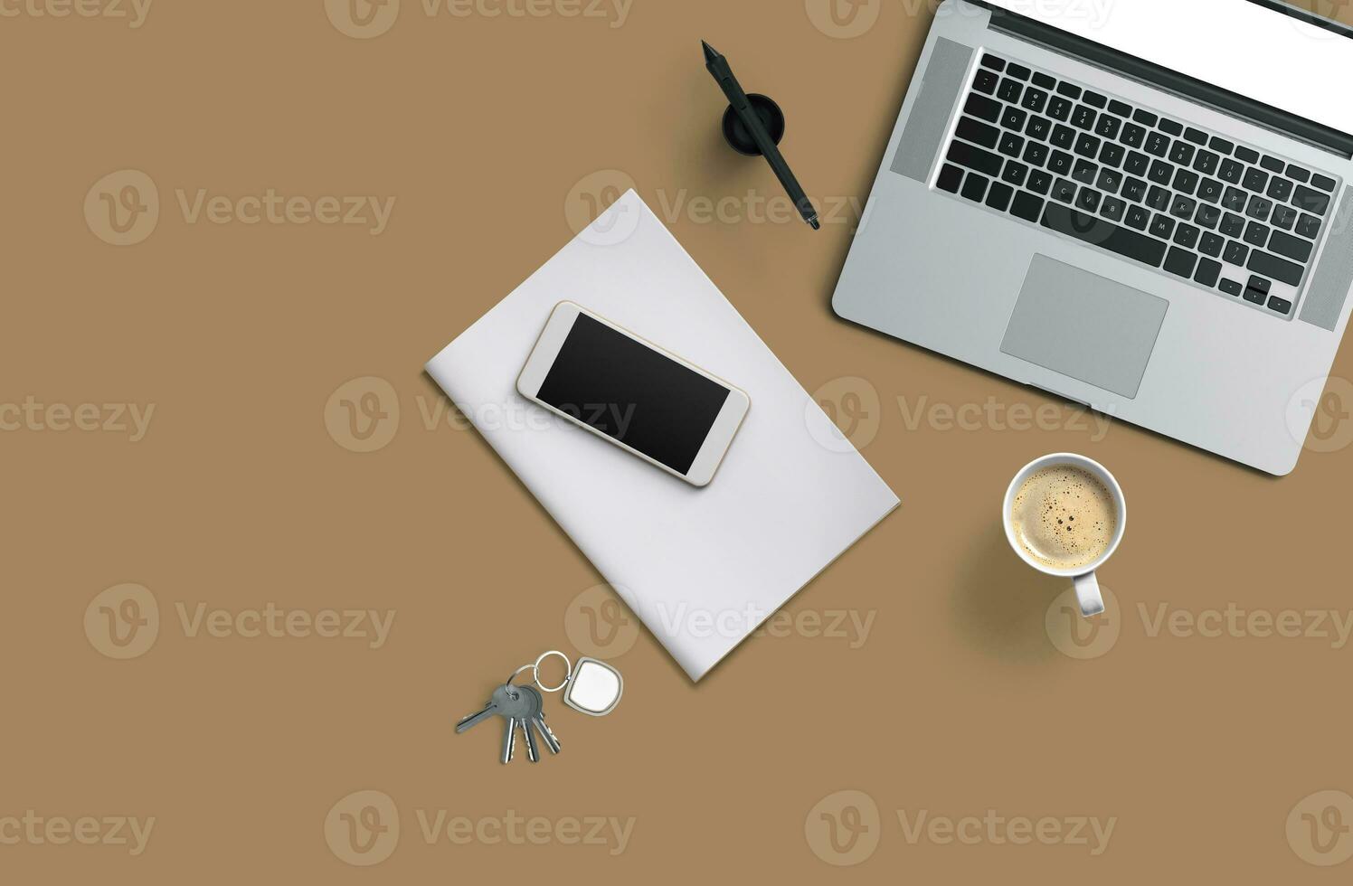 Office desk table with laptop computer, smartphone with black screen over a notebook and cup of coffee. Top view. photo